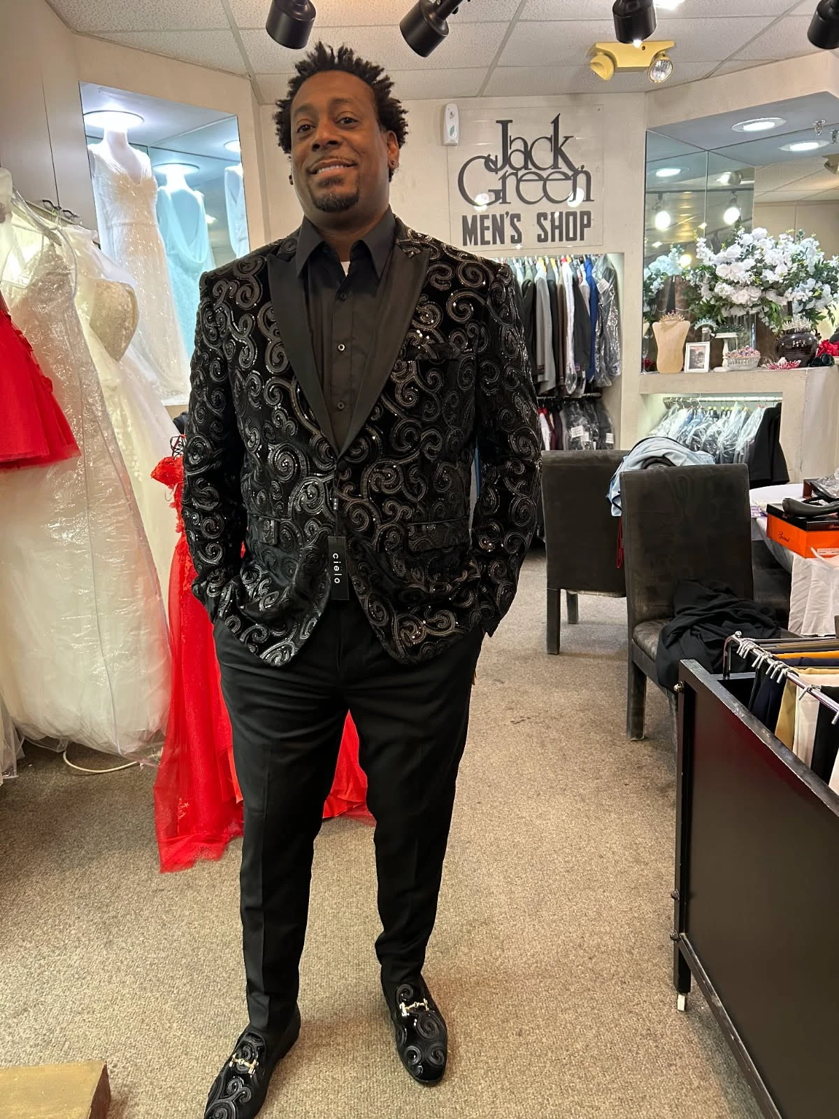 Adult client in black sequin swirl blazer with matching swirl loafers