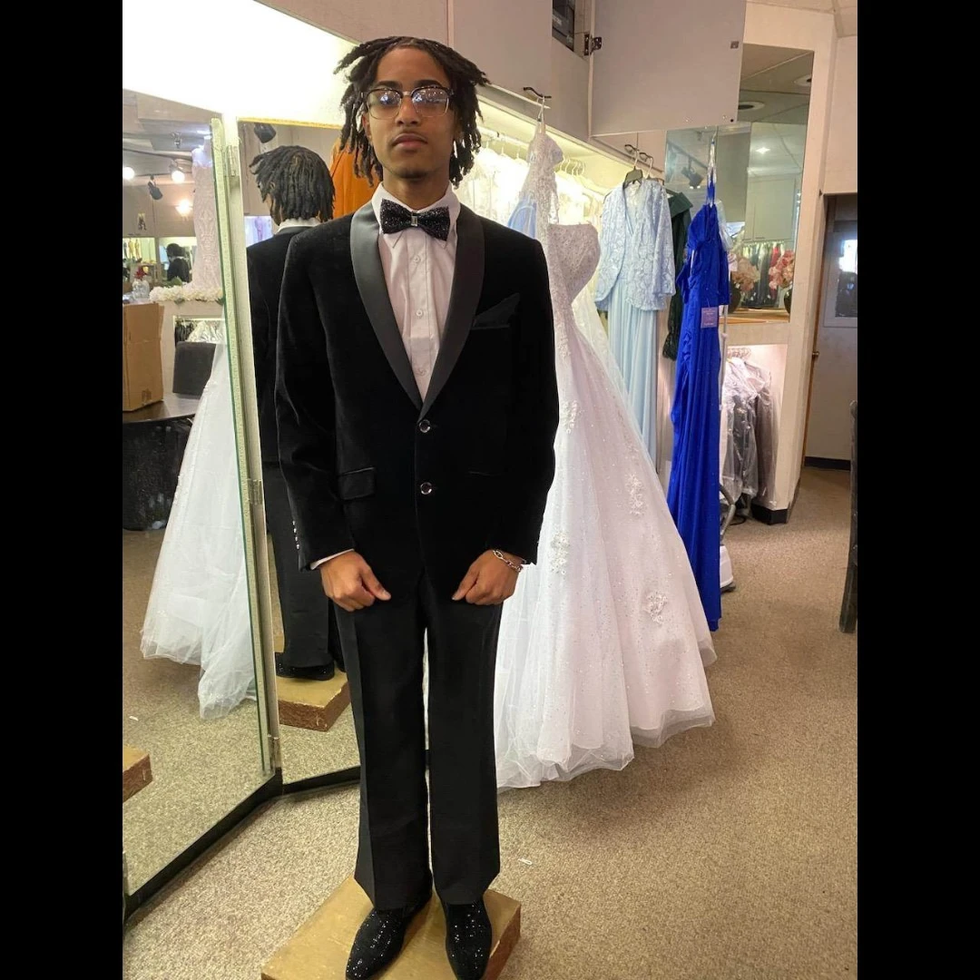 Client in black velvet tuxedo with sparkle bow tie and crystal loafers