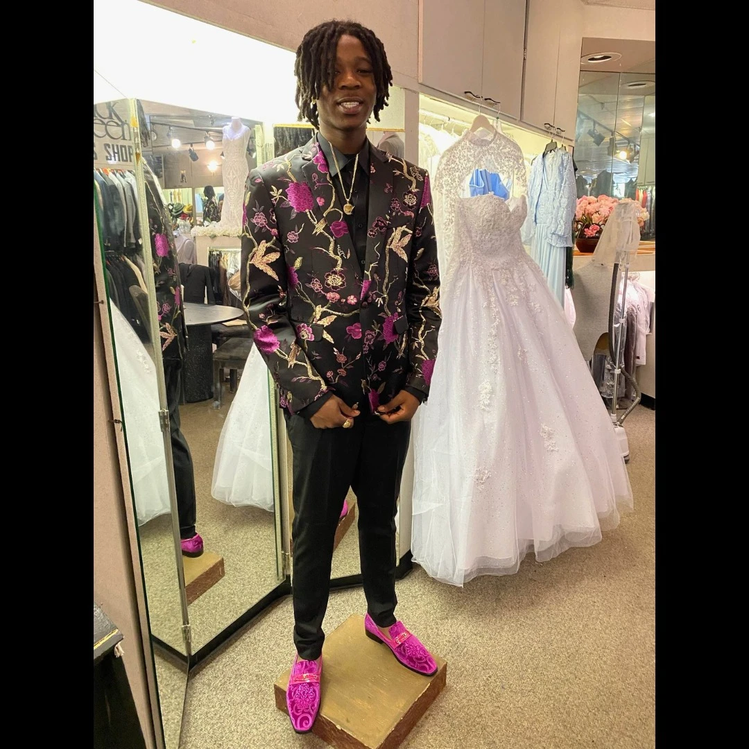 Client in black and magenta floral blazer with matching fuchsia loafers