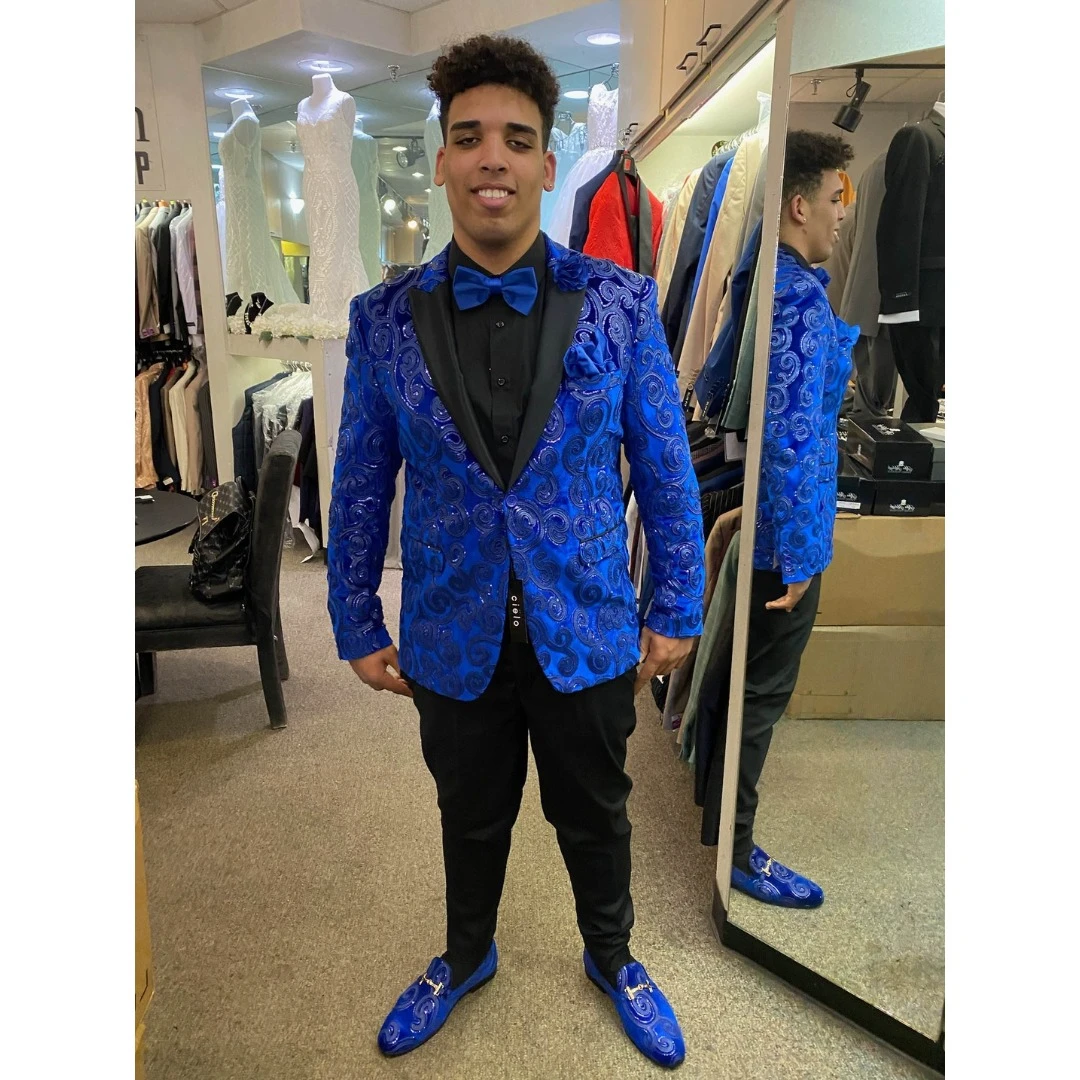 Client in royal blue swirl pattern blazer with matching loafers and bow tie