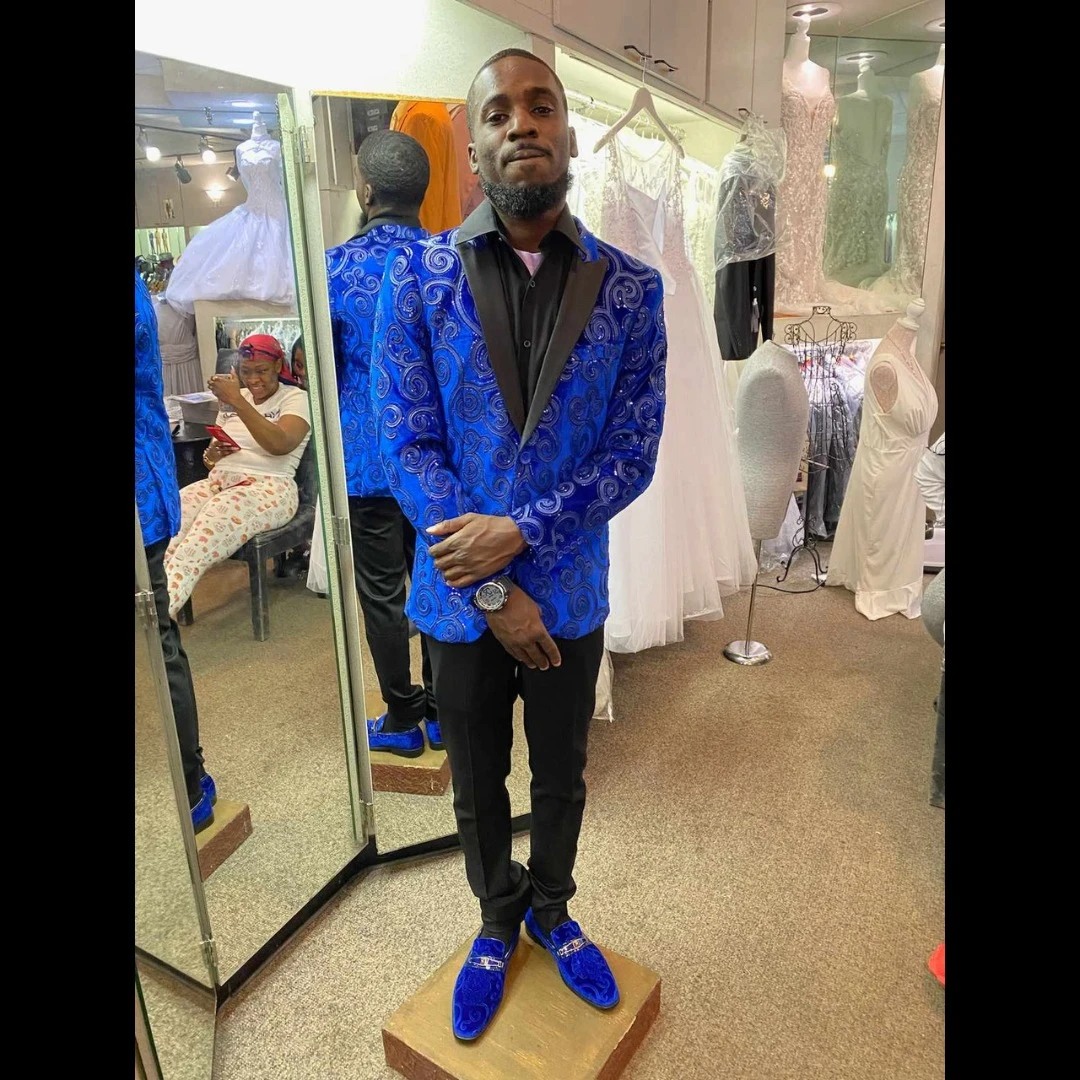 Client in royal blue swirl pattern blazer with matching blue velvet loafers