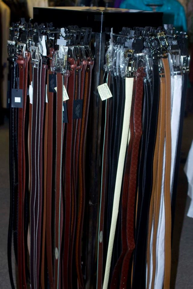 Leather belts in brown, tan, black, and cream