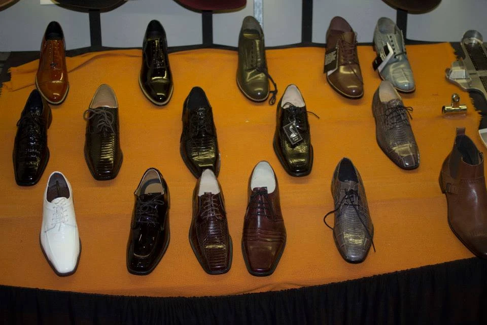 Collection of men's dress shoes including oxfords, loafers, and boots