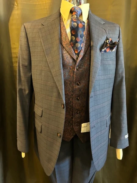 Blue plaid three-piece suit with brown paisley vest and polka dot tie