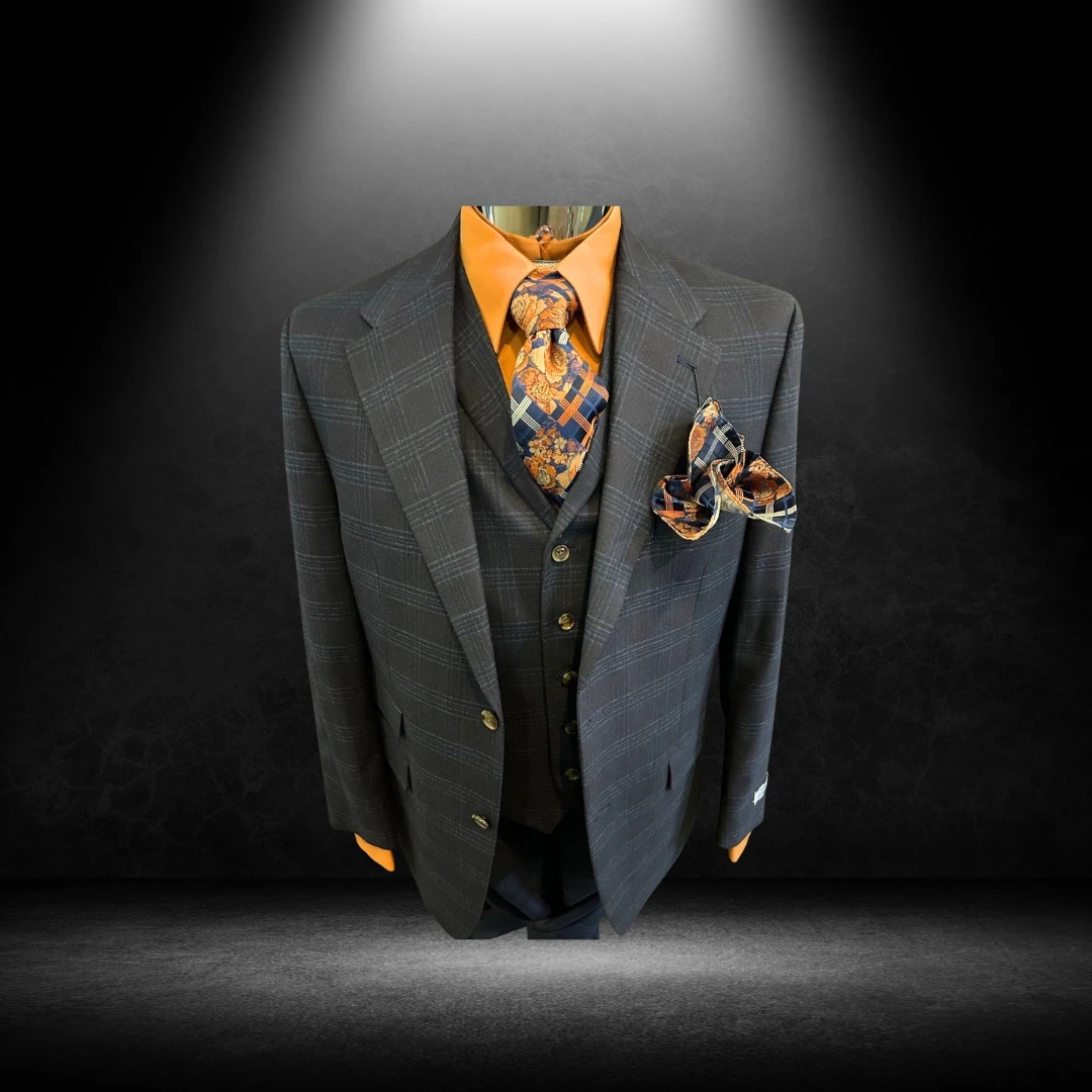 Charcoal plaid three-piece suit with orange shirt and floral tie