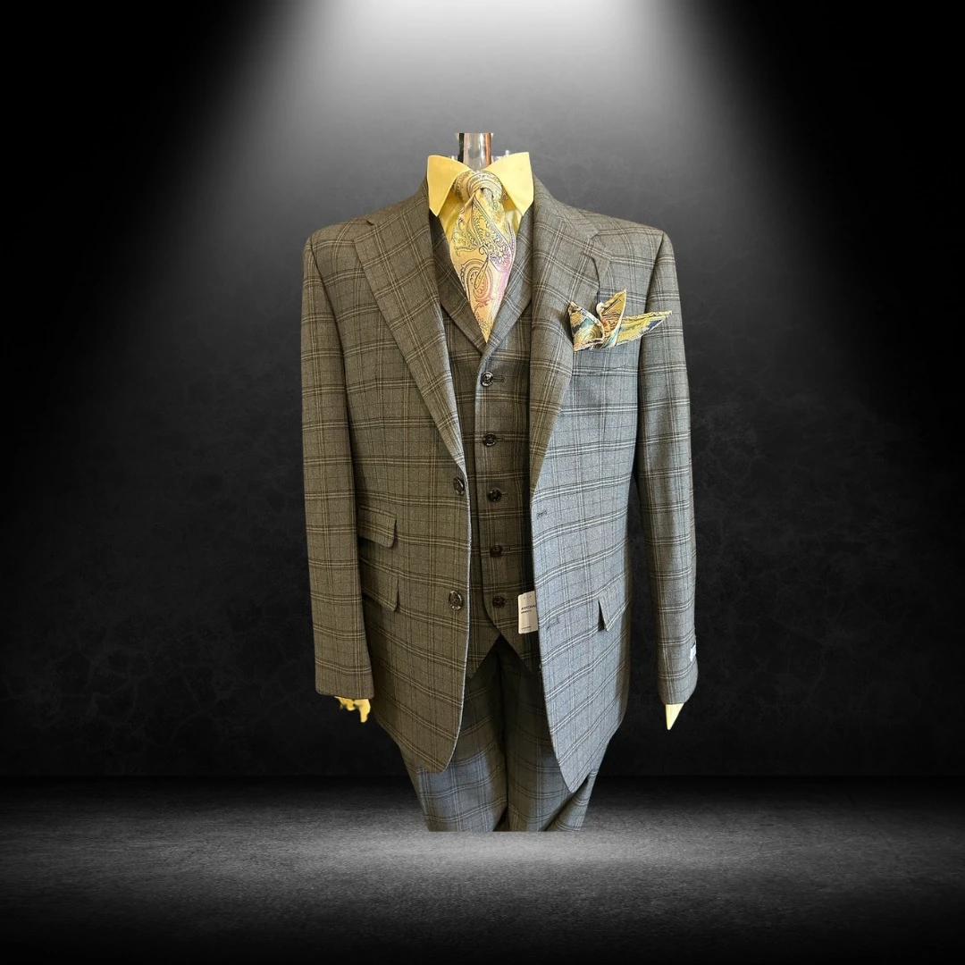 Olive and grey plaid three-piece suit with yellow shirt and paisley tie