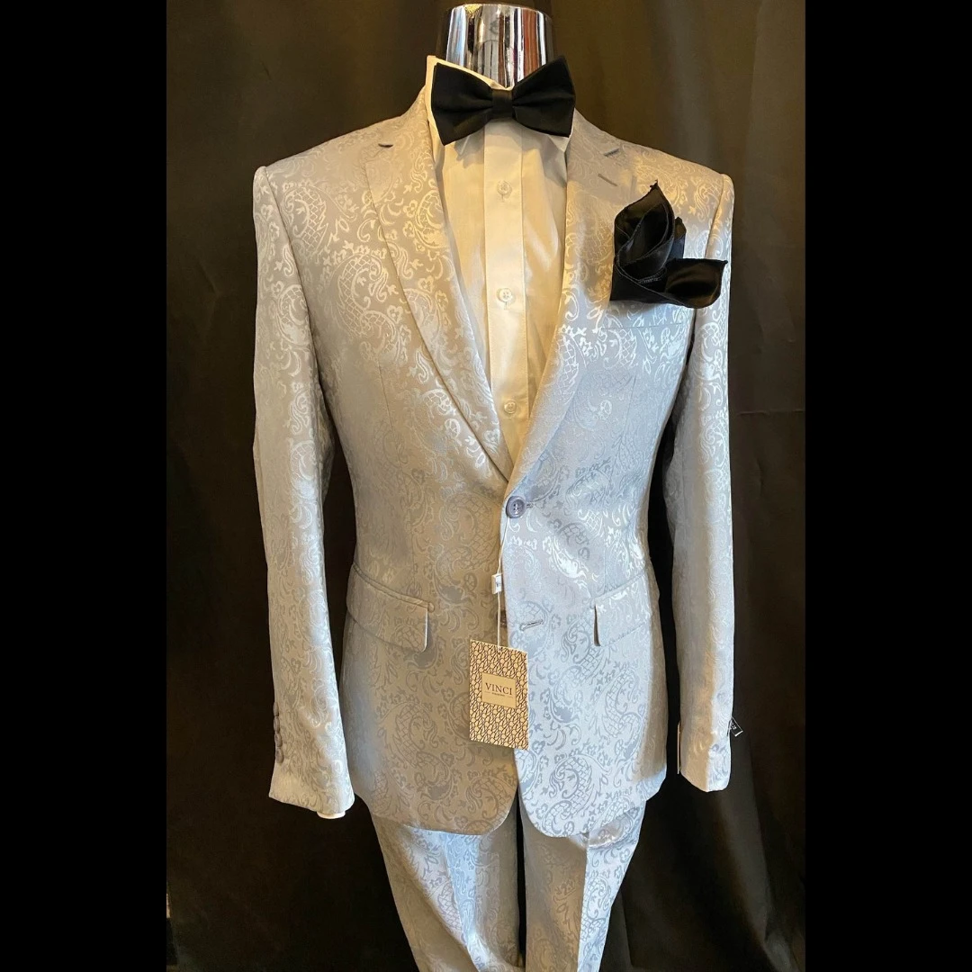 Silver paisley suit with black bow tie and pocket square